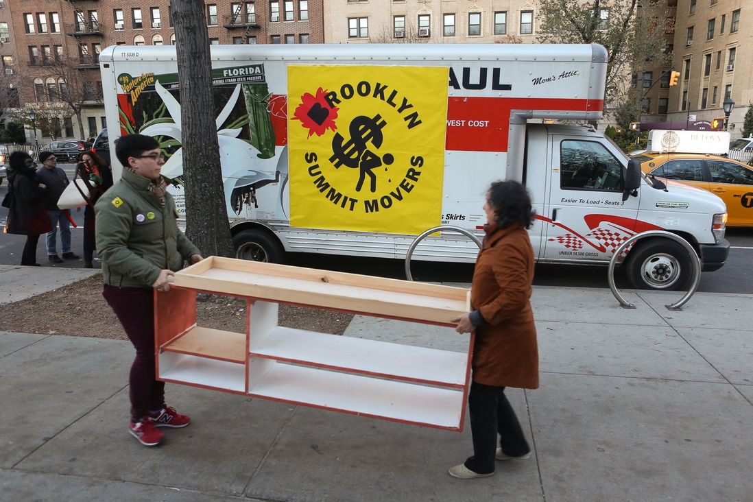 Activists unload furniture to set up house in front of the Brooklyn Museum.<br/>